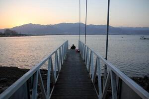 A pier on the shore for mooring boats and yachts. photo