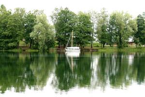 A pier on the shore for mooring boats and yachts. photo