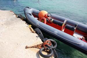 A pier on the shore for mooring boats and yachts. photo