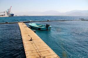 A pier on the shore for mooring boats and yachts. photo