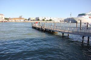 A pier on the shore for mooring boats and yachts. photo