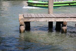 A pier on the shore for mooring boats and yachts. photo