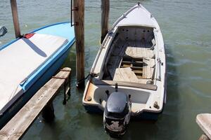 A pier on the shore for mooring boats and yachts. photo