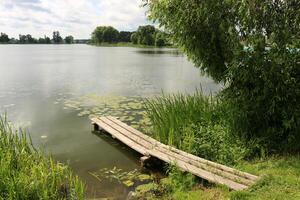 A pier on the shore for mooring boats and yachts. photo