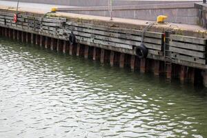 A pier on the shore for mooring boats and yachts. photo