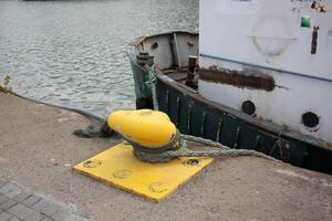 A pier on the shore for mooring boats and yachts. photo