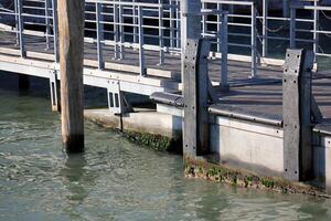 A pier on the shore for mooring boats and yachts. photo