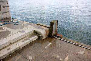 A pier on the shore for mooring boats and yachts. photo