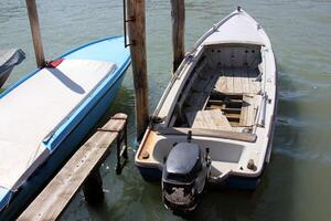 A pier on the shore for mooring boats and yachts. photo