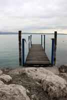 A pier on the shore for mooring boats and yachts. photo