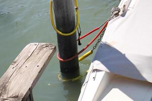 A pier on the shore for mooring boats and yachts. photo