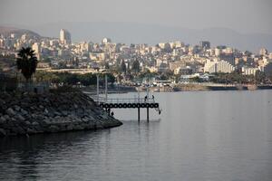 A pier on the shore for mooring boats and yachts. photo