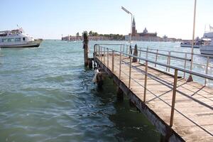 A pier on the shore for mooring boats and yachts. photo