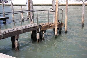 A pier on the shore for mooring boats and yachts. photo