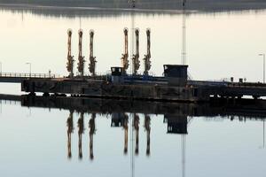 A pier on the shore for mooring boats and yachts. photo