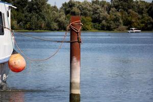 A pier on the shore for mooring boats and yachts. photo