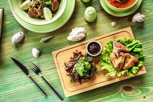 Wooden Table With Plates of Food photo