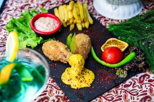 Close Up of a Beautifully Arranged Plate of Food on a Table photo