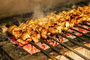Close-Up of Sizzling Food Cooking on a Grill photo