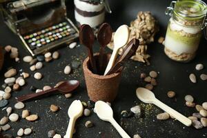 Spoons and Spoons in a Cup on a Table photo