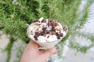 Person Holding a Dessert in a Glass Bowl photo