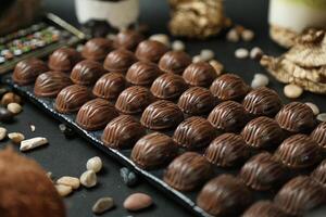 Abundant Assortment of Chocolates and Nuts on a Table photo