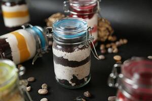 Jar Filled With Assorted Food on a Table photo