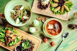 Wooden Table Displaying Assorted Food Bowls photo