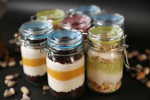 Group of Jars Filled With Food on Table photo