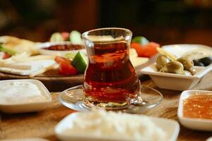 Glass of Tea on Wooden Table photo