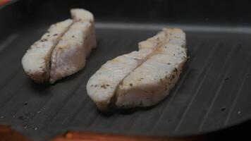 Professional chef grill white fish fillet steak video