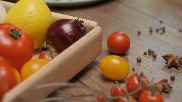 Table with vegetables, spices and chicken roll video