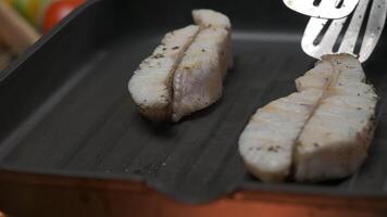 Professional chef grill white fish fillet steak video