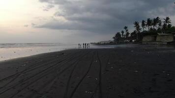 People on the ocean at high tide in Indonesia video