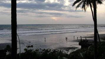 People on the ocean at high tide in Indonesia video