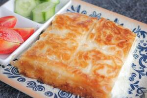 Traditional Turkish Cuisine Pastries borek on a plate photo