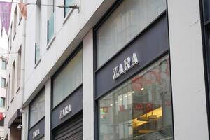 Turkey istanbul 18 july 2023., Zara store front featuring a metal sign in a modern font on a glass facade photo