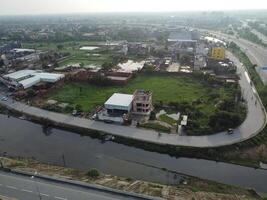 View at city from bird sight. City from drone. Aerial photo. City scape from drone on 2023-07-22 in Lahore Pakistan photo