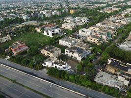 View at city from bird sight. City from drone. Aerial photo. City scape from drone in Lahore Pakistan on July 22, 2023. photo