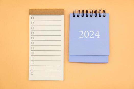 Blank to do list for text with checkbox and Simple desk 2024 calendar. Empty Check list. Copy Space. isolated background. To do list in 2024. photo