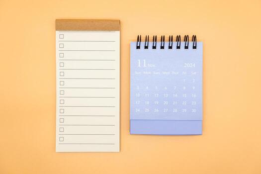 Blank to do list for text with checkbox and Simple desk calendar on NOVEMBER 2024. Empty Check list. Copy Space. isolated background. To do list in November 2024. photo