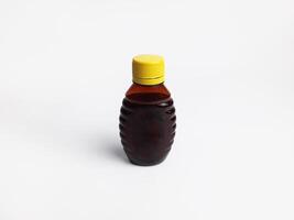 honey bottle in the shape of a bee photo