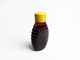 miel botella en el forma de un abeja foto