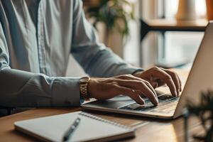 Business professional in formal dress working on a laptop in modern office photo