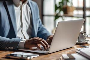 Businessman working on laptop on table photo