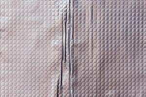 de cerca fotograma completo antecedentes y textura de aluminio saburral butilo caucho sábana con cuadrado modelo. foto
