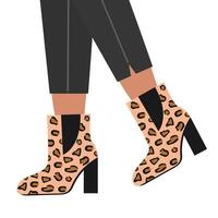 Female legs in leather boots with leopard print vector