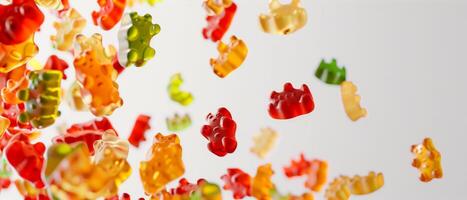 Colorful Gummy Bears Falling from Above on white background photo