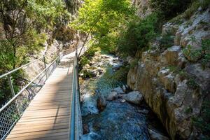 Sapadere canyon with wooden paths and cascades of waterfalls in the Taurus mountains near Alanya, Turkey photo
