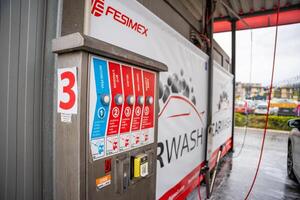 Prague, Czech Republic - April 5, 2024. Automat with different washing modes in self service car washing station in Prague, Europe. High quality photo